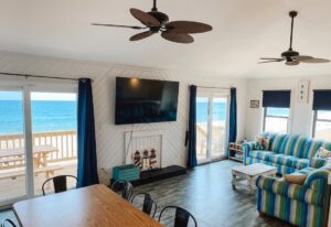 Living room in oceanfront Outer Banks beach house rental with ocean and beach views
