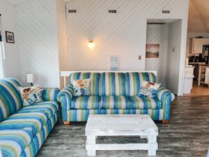 Living room in oceanfront Outer Banks beach house rental with ocean and beach views