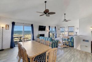 Dining and Living room in oceanfront Outer Banks beach house rental with ocean and beach views