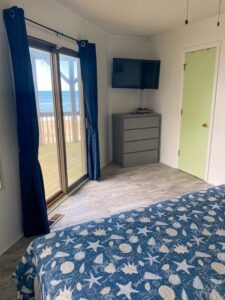 Master bedroom with king bed in OBX oceanfront vacation rental