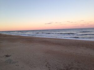 Sandy shoreline steps from OBX beach house